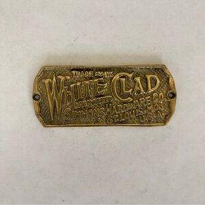 Vintage White Clad Simmons Hardware Co Brass Embossed Nameplate Tag St Louis MO